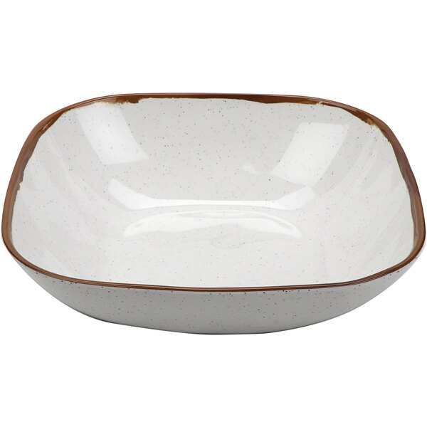 A white bowl with brown rim.
