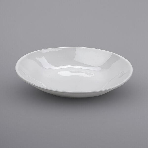 A white bowl on a gray surface.
