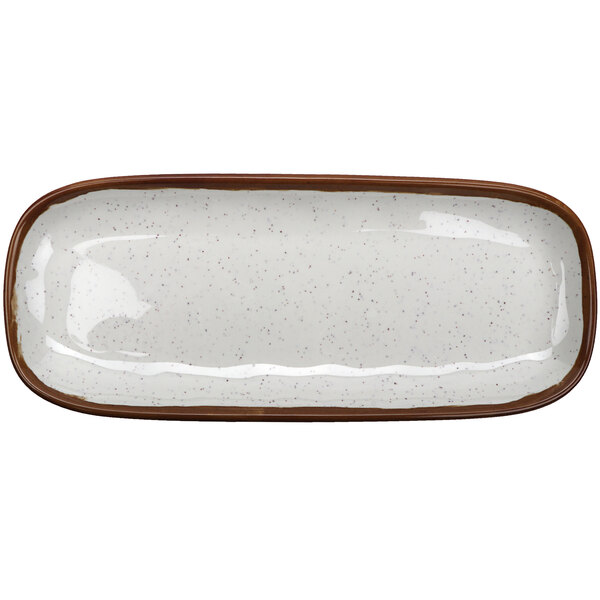 A white rectangular melamine platter with brown speckles and a brown edge.