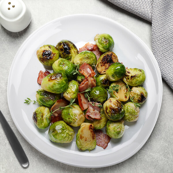 A plate of brussels sprouts and bacon on a white GET Arctic melamine plate.