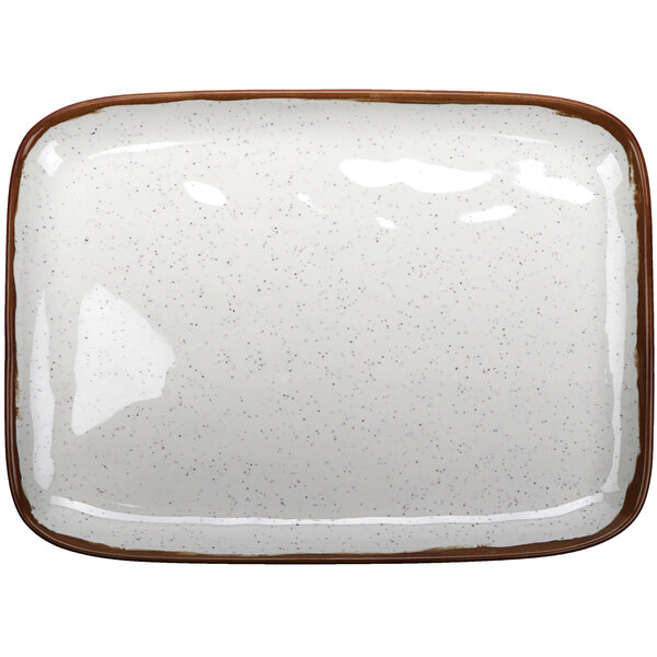 A white rectangular melamine platter with brown speckled edges.