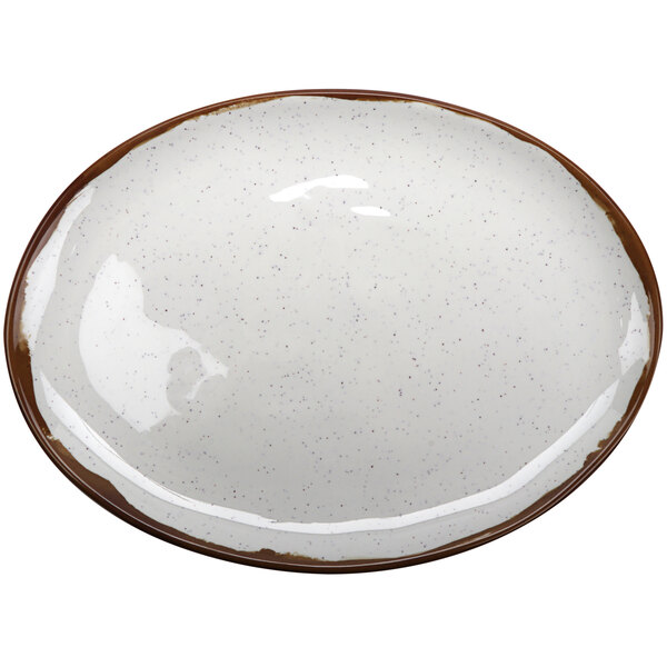 A white oval melamine platter with brown speckled edges.