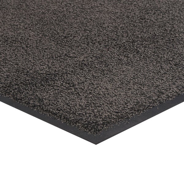 A gray carpet mat with a black border and rubber backing.