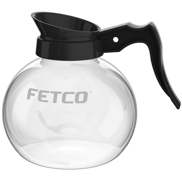 A glass coffee pot with a black handle.