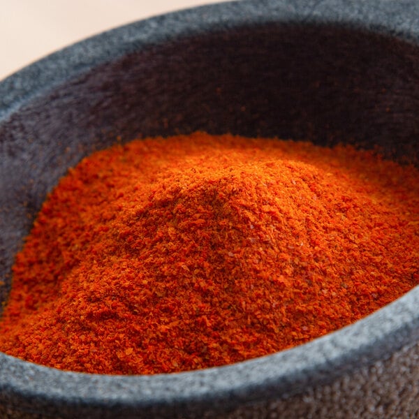 A bowl of Regal extra hot ground cayenne pepper powder.