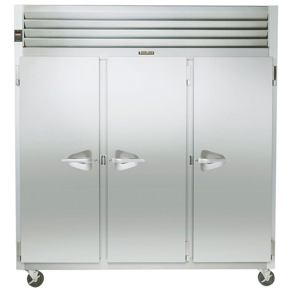 A Traulsen G Series reach-in freezer with three stainless steel doors.