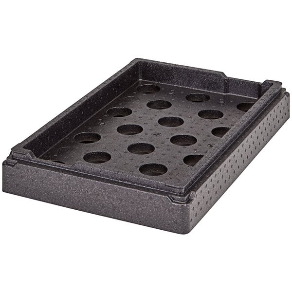 A black Cambro Camchiller tray with holes.