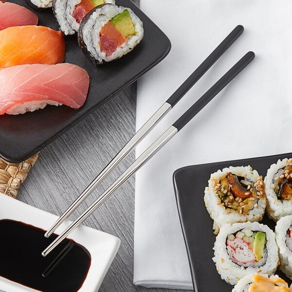 A plate of sushi with Acopa stainless steel chopsticks.
