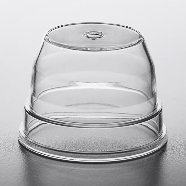 A clear plastic lid on a table.