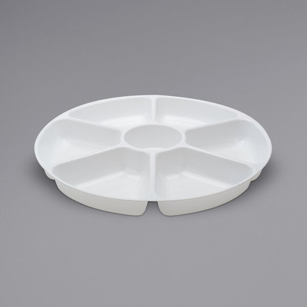 A white plastic Fineline tray with seven compartments.