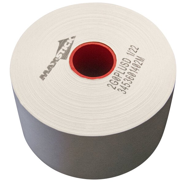 A roll of white MAXStick linerless paper with a red circle in a white circle.