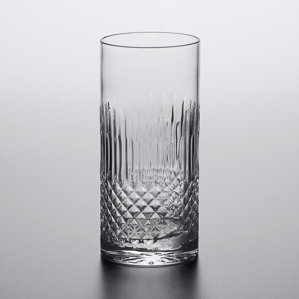 A close up of a Luigi Bormioli highball glass with a diamond cut design.