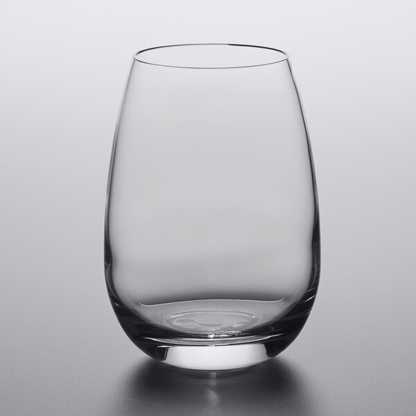 A Luigi Bormioli stemless wine glass with a curved bottom on a white surface.