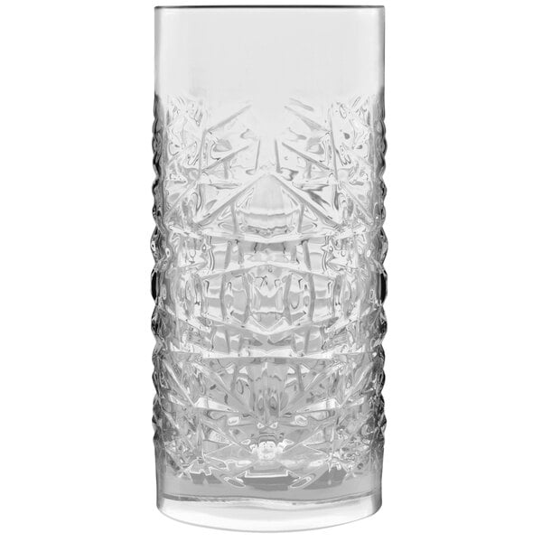 A clear Luigi Bormioli highball glass with a pattern on it.