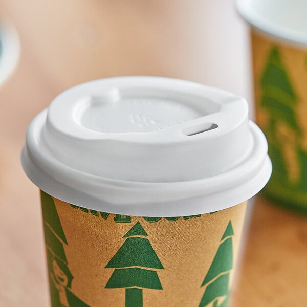 A translucent EcoChoice paper hot cup lid on a paper coffee cup.