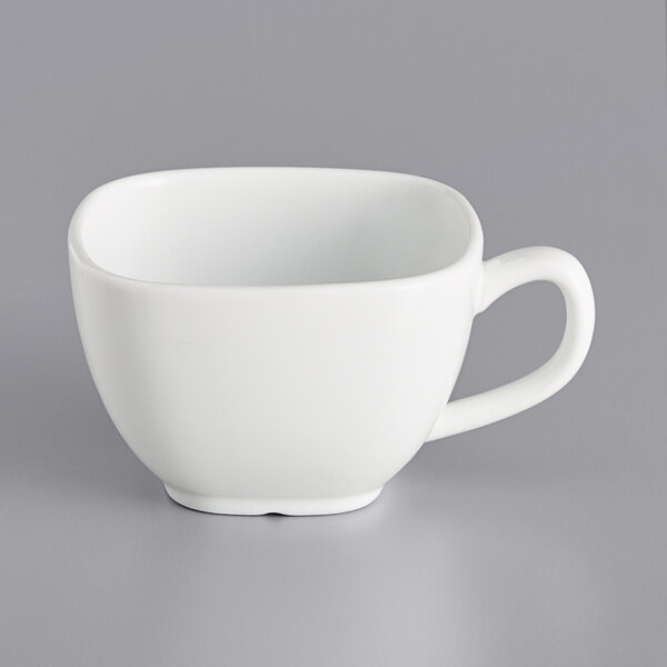 An International Tableware bright white porcelain tall cup with a handle.