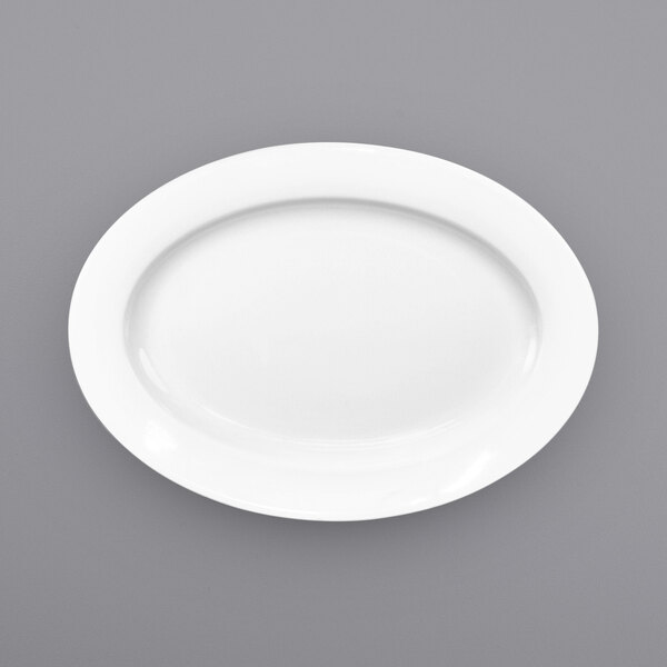 A white International Tableware porcelain platter with a wide, round edge.