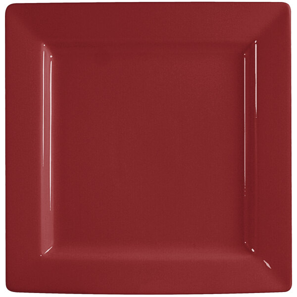 An International Tableware square porcelain plate with a white border and a red surface.