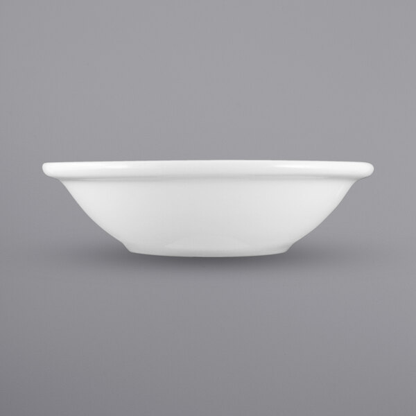 A white International Tableware porcelain fruit bowl with a rolled edge.