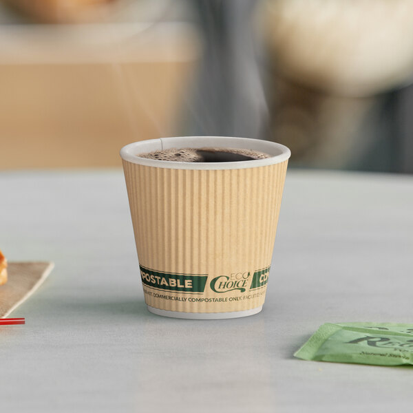 A EcoChoice double wall paper hot cup of coffee on a table.