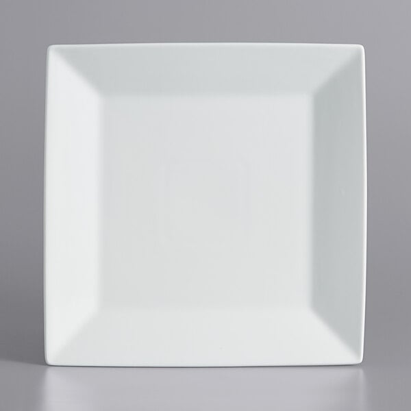 An International Tableware bright white square porcelain plate with a wide rim.