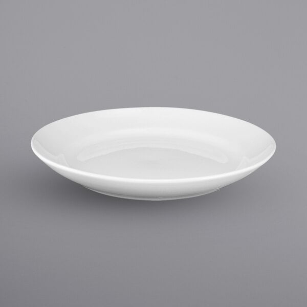 A white International Tableware porcelain pasta bowl with a rolled edge.