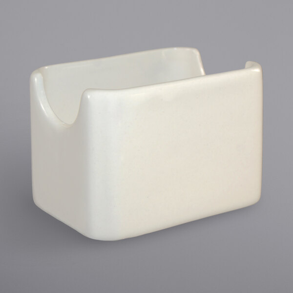An International Tableware ivory porcelain sugar packet holder.