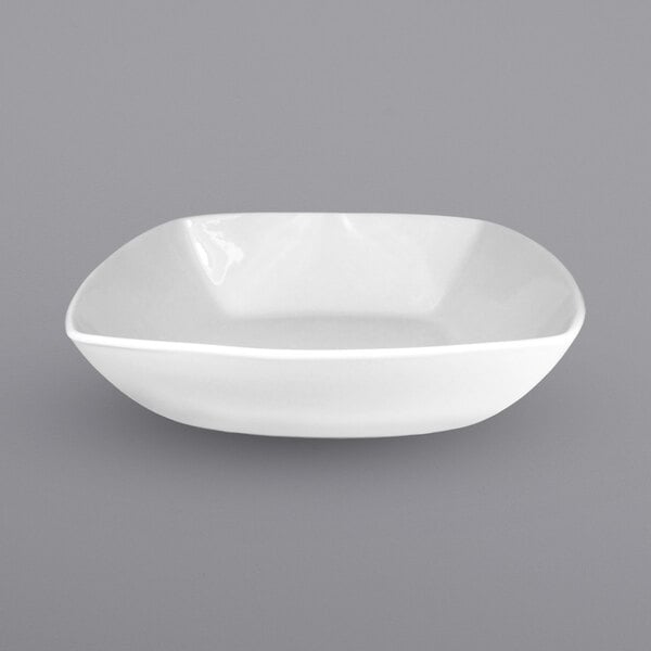 A white square International Tableware porcelain bowl.
