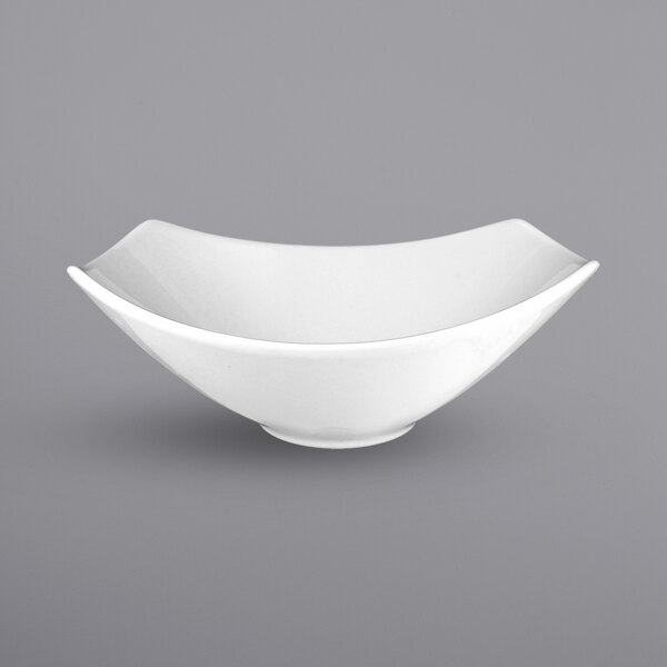An International Tableware square white bowl with a curved edge.