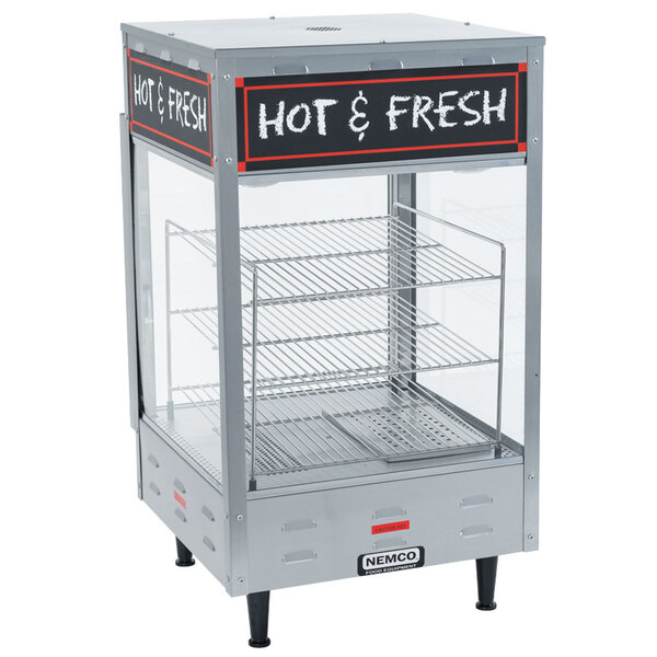 A Nemco countertop hot food display case with a sign on it.