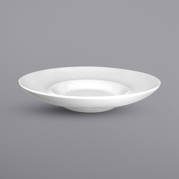 A white International Tableware Bristol porcelain bowl with a wide rim.