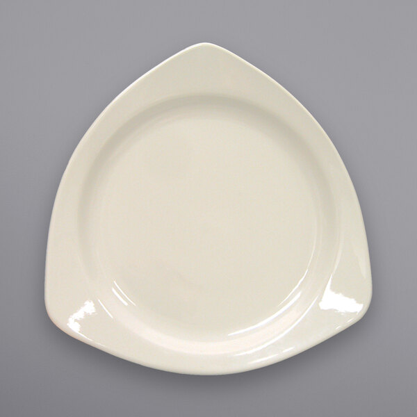 An International Tableware Valencia triangular stoneware plate in white.