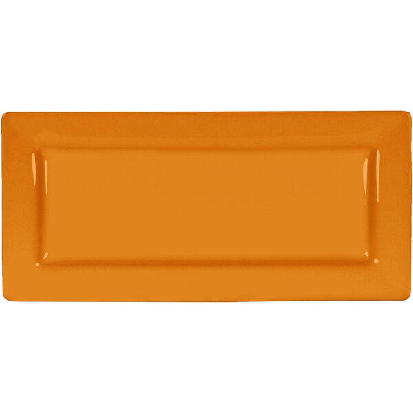 An orange rectangular International Tableware porcelain platter with a wide rim.