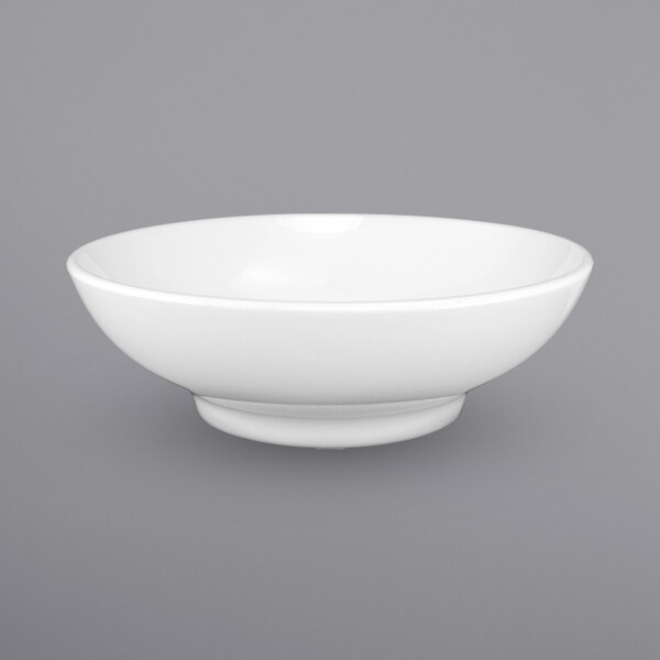 A close-up of a International Tableware Torino white bowl.