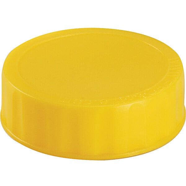 A yellow plastic cap for FIFO squeeze bottles.