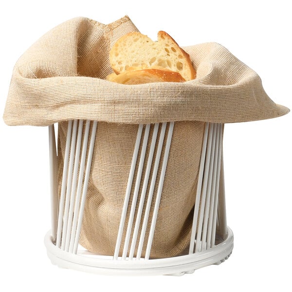 A white wire basket with a baguette inside.