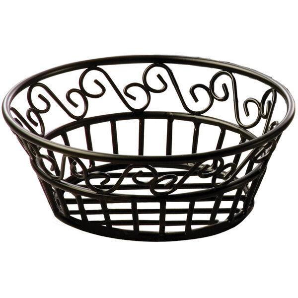 An American Metalcraft black wrought iron bread basket with swirl designs.