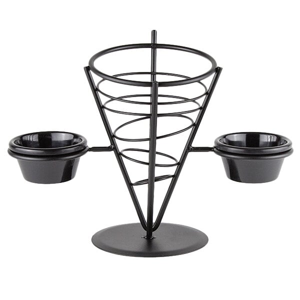 An American Metalcraft black wrought iron wire fry basket with 2 ramekin holders on a table.