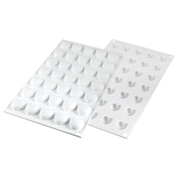 A close-up of a white Silikomart Micro Love5 silicone baking mold with heart-shaped cavities.