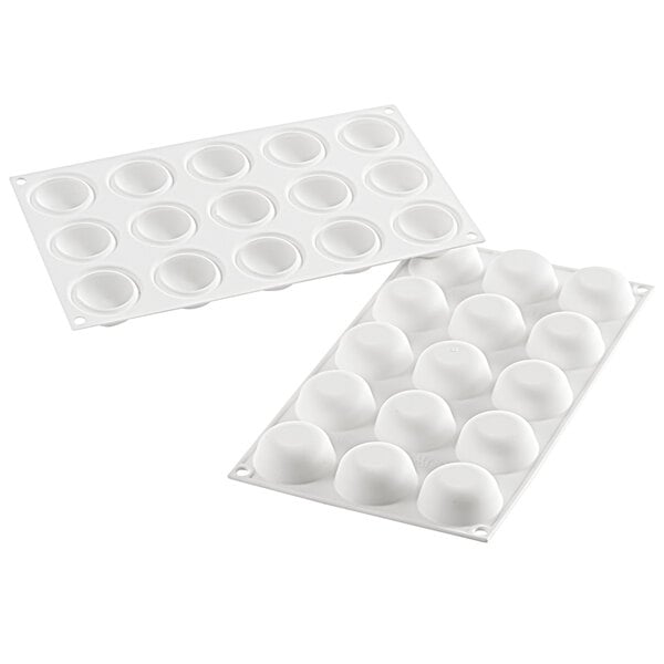 A white Silikomart silicone baking mold tray with round cavities.