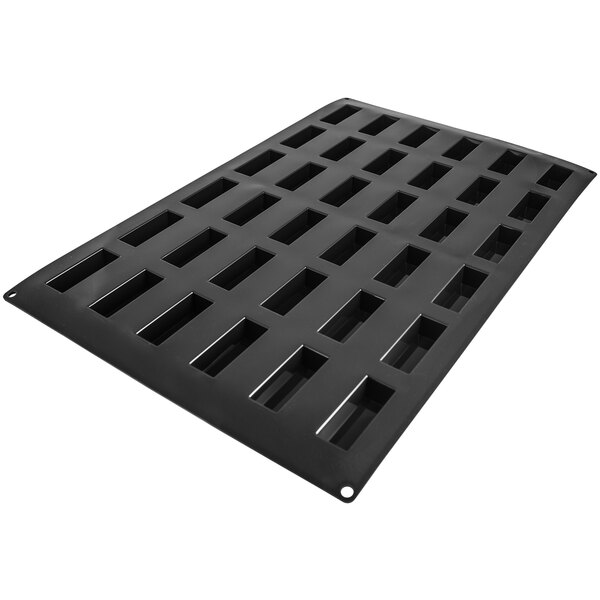 A black rectangular Silikomart silicone baking mold with 36 financiers cavities.