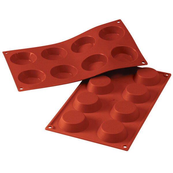 A red Silikomart silicone baking mold with eight tartelette cavities.