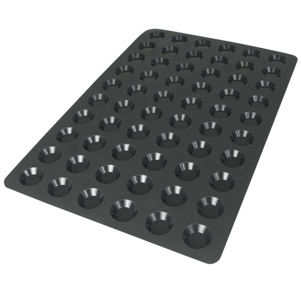 A black Silikomart silicone baking mold with 60 square cavities.