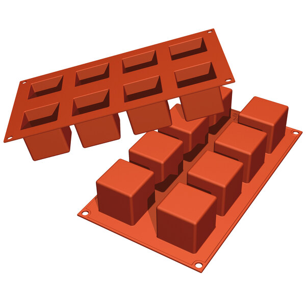 A Silikomart orange silicone baking mold with eight cube cavities.