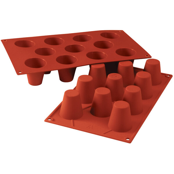 A red silicone baking mold with 11 medium baba cavities.