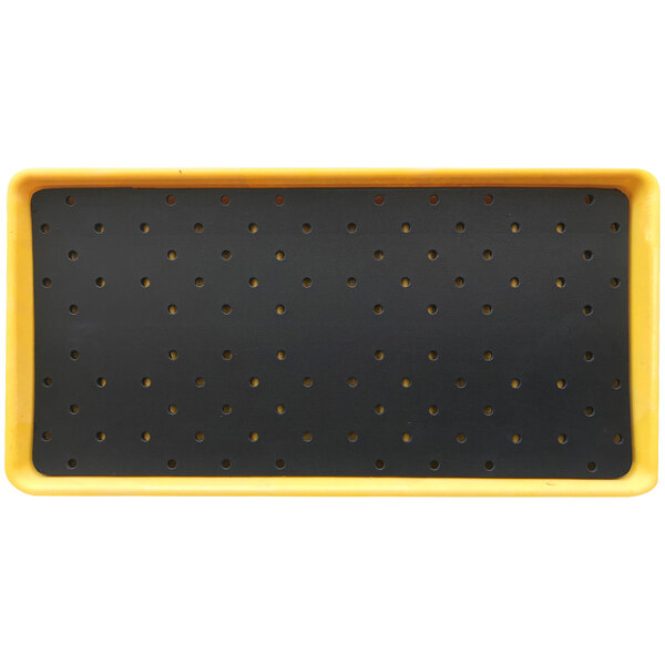 A black and yellow Notrax boot wash station tray with holes.