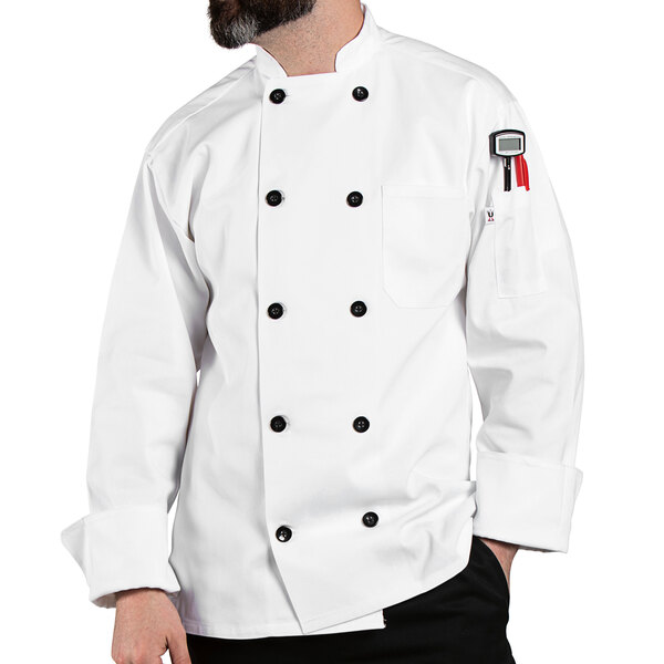 A man wearing a white long sleeve Uncommon Chef Moroccan chef coat.