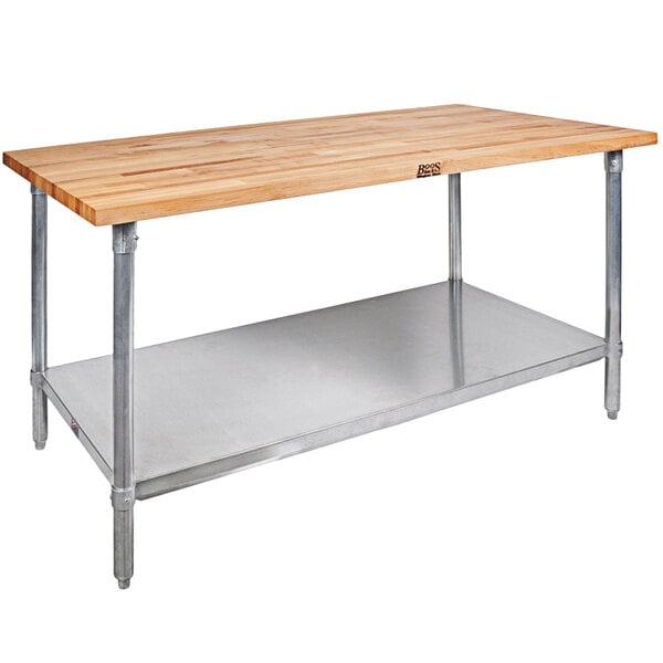A John Boos wood top work table with metal shelves.