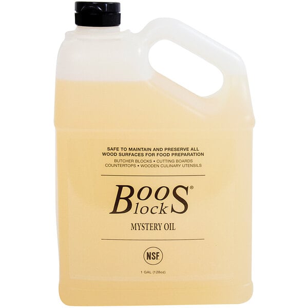 A plastic jug of yellow John Boos mystery oil with a label.