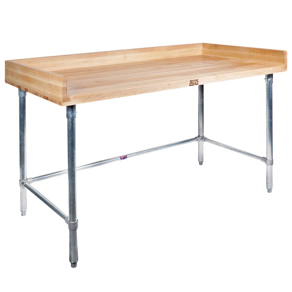 A John Boos wood table with metal legs.